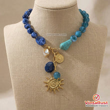 Load image into Gallery viewer, Blue Acrylic Beaded Necklace with Gold Sun Charm