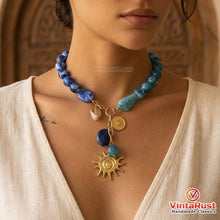 Load image into Gallery viewer, Blue Acrylic Beaded Necklace with Gold Sun Charm